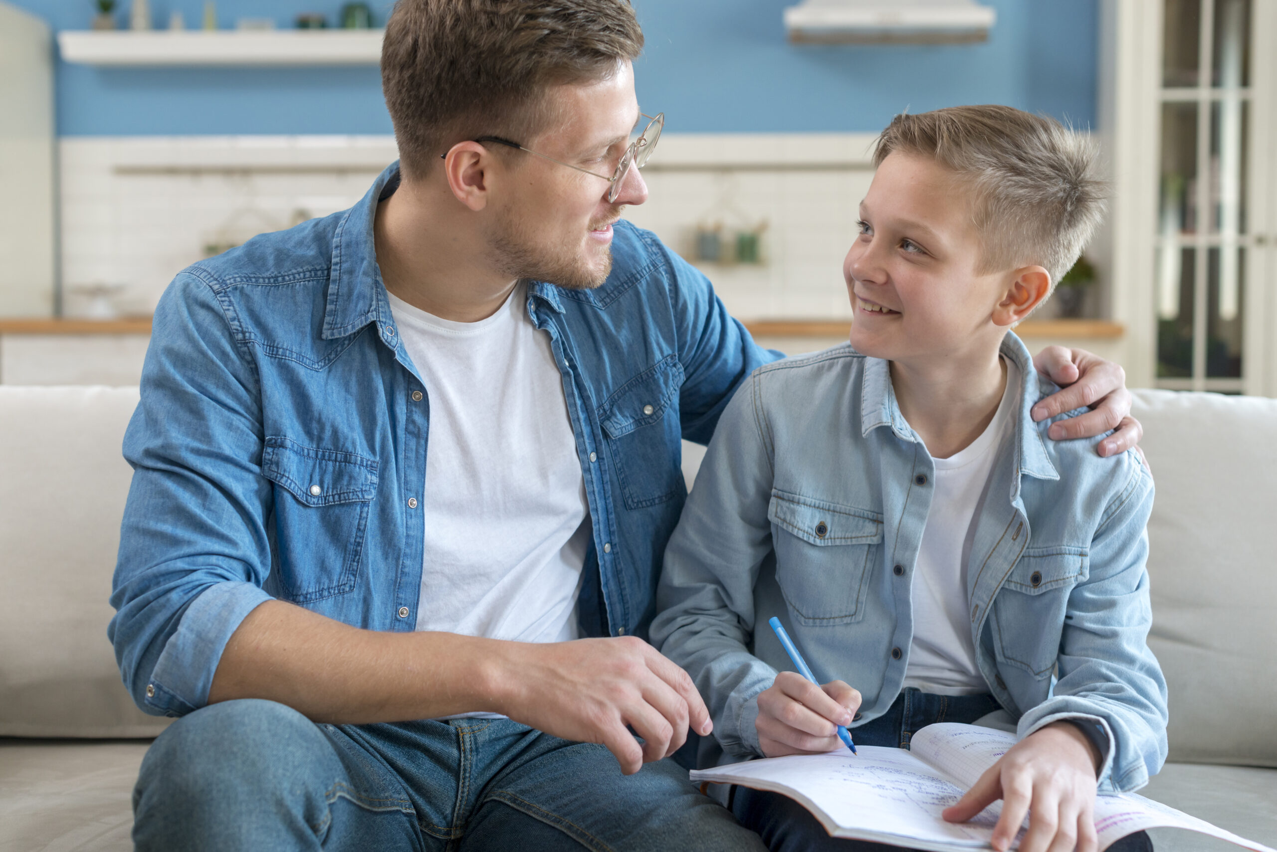 happy-father-helping-his-son-with-homework