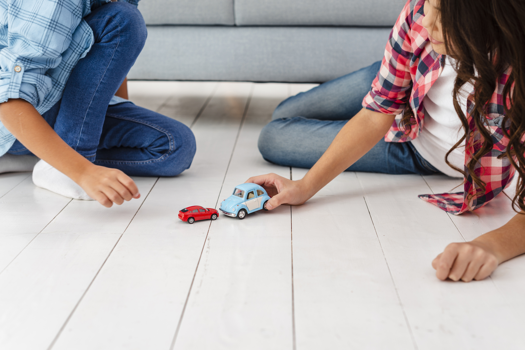 high-angle-siblings-playing-with-toys