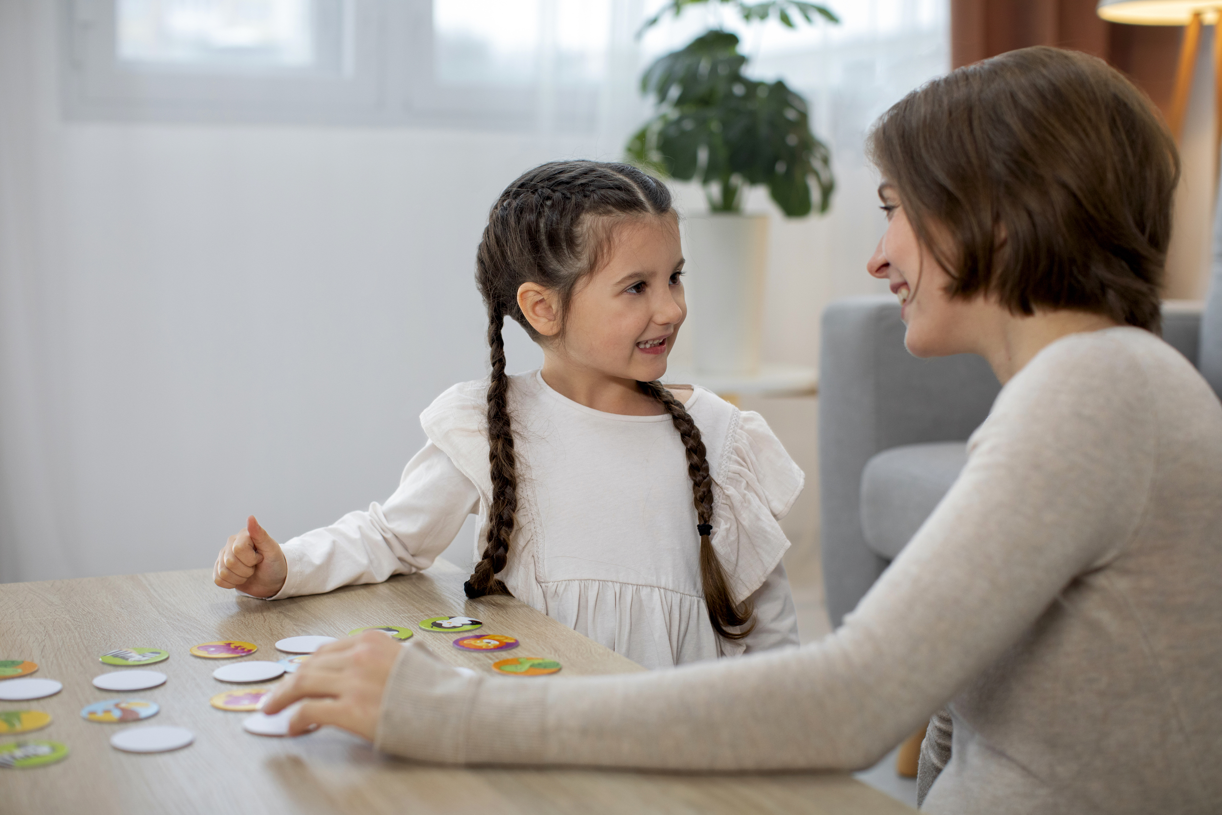 medium-shot-mother-girl-playing-game