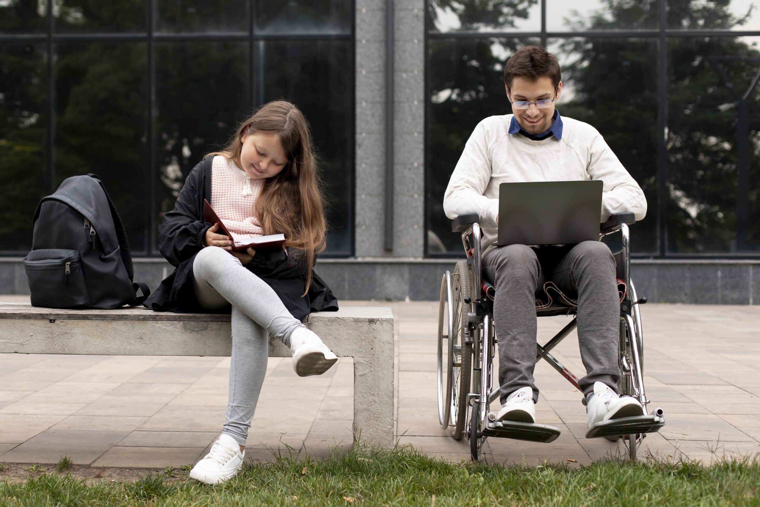 disabled-man-helping-girl-learn