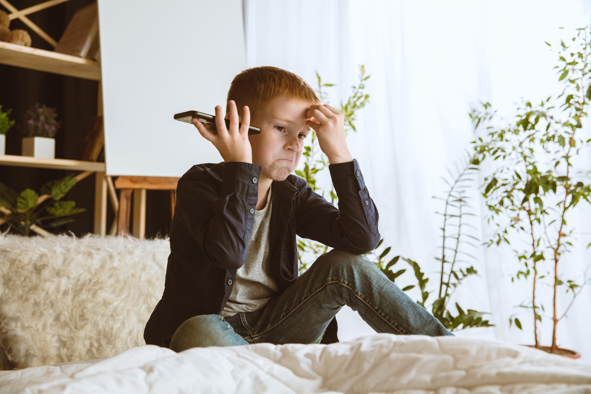 boy-using-different-gadgets-home-little-model-with-smart-watches-smartphone-tablet-headphones-making-selfie-chating-gaming-watching-videos-interaction-kids-modern-technologies (1)